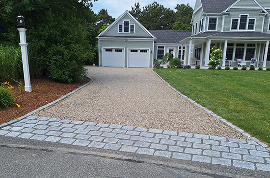 Cobblestone edging a driveway Falmouth, MA