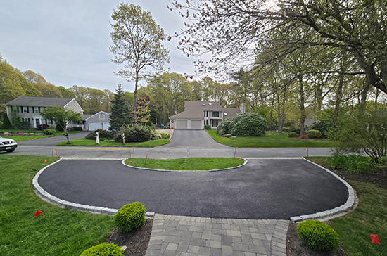 new circular driveway paving with stone apron border Falmouth, MA Cape Cod